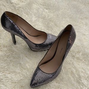 Silver sequined platform pumps.